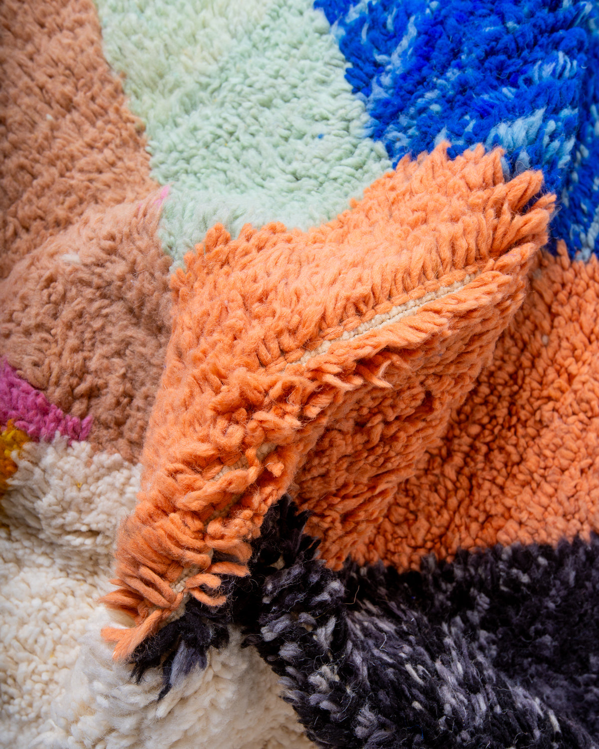 Modern, designer, handcrafted Berber rug from Morocco. Beniourain carpet with beautiful colours and patterns and fluffy wool texture.